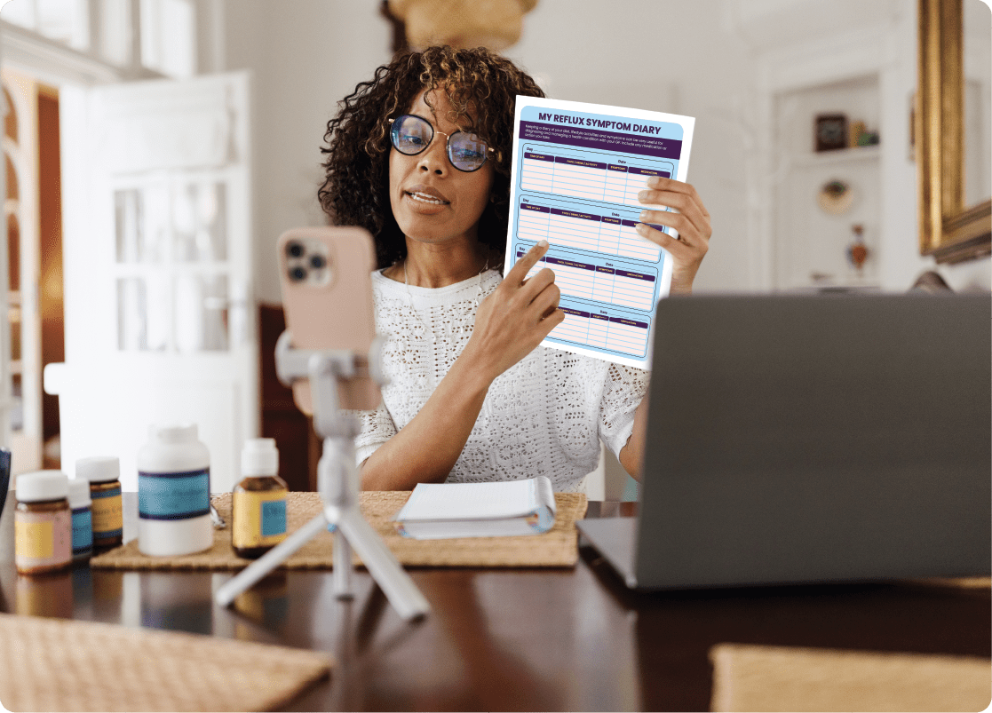 Doctor providing patient education to an older woman during consultation.