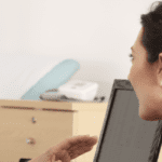 A doctor is advising her patients and educating them, applying the strategy to overcome the barriers to patient education